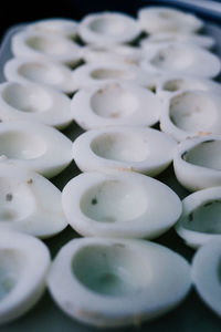 High angle view of white eggs on table