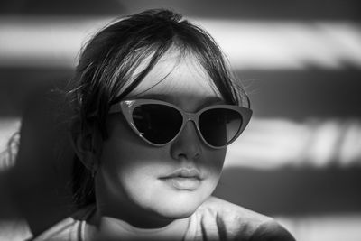 Close-up of young woman wearing sunglasses