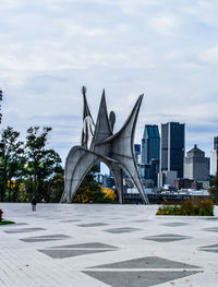 View of modern building against cloudy sky