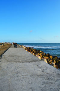 Scenic view of sea against clear blue sky