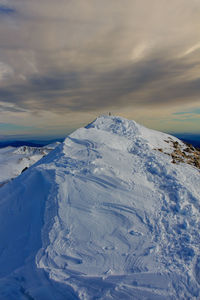 Scenic view of snowcapped mountain against sky