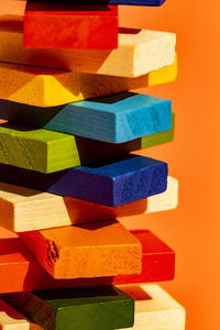 Close-up of stuffed toy against orange background