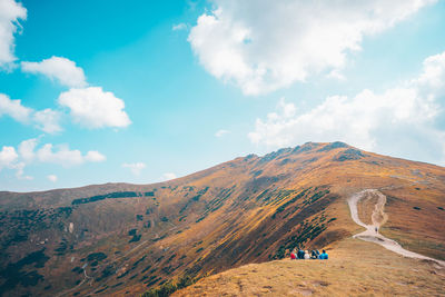 Scenic view of mountain against cloudy sky