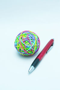 High angle view of colored pencils on white table