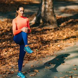Woman stretching in the park after jogging.
