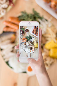 Close-up of person holding mobile phone