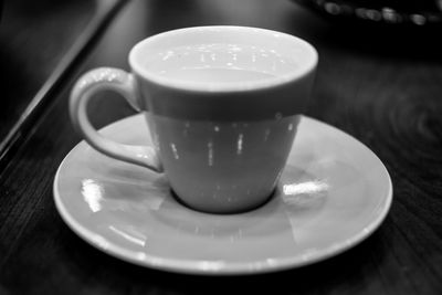 Close-up of coffee cup on table