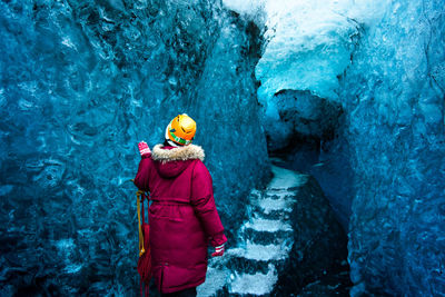 Full length of person holding ice cream in cave