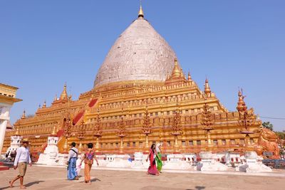 Group of people in temple against building