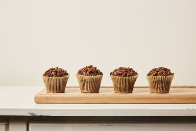 Close-up of cupcakes against white background