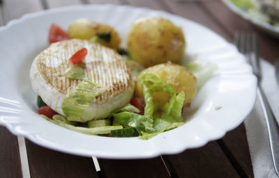 High angle view of fruits in plate on table