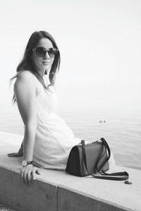 Portrait of a young woman sitting on beach