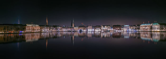 Reflection of buildings in city at night