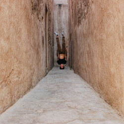 Full length of woman walking on footbridge