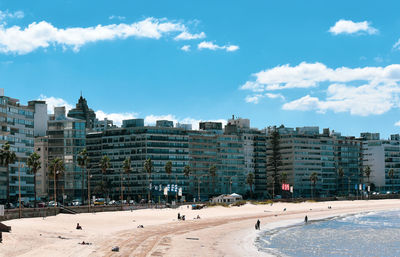 Buildings in city against sky