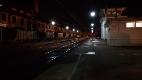 View of illuminated railroad tracks at night