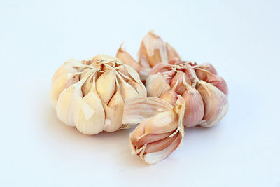 Close-up of garlic against white background