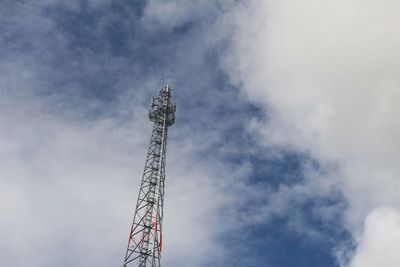 Low angle view of crane against sky