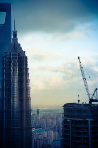 Modern buildings in city against sky