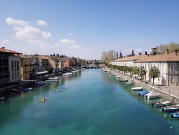 High angle view of water canal by buildings in city