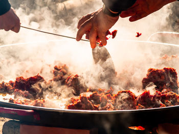 Midsection of person preparing food