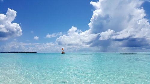 Scenic view of sea against cloudy sky