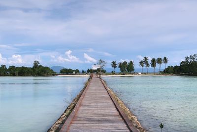 Pier over sea against sky