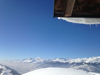 Scenic view of snow covered mountains