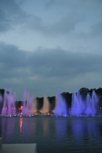 Reflection of illuminated buildings in water