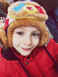 Portrait of smiling boy in winter