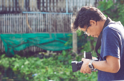 Young man photographing