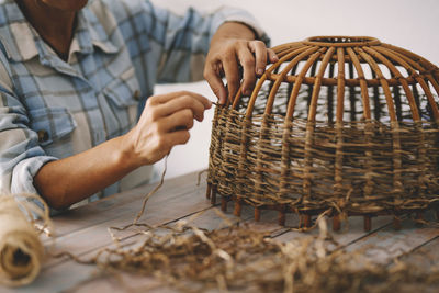 Man working in basket on table