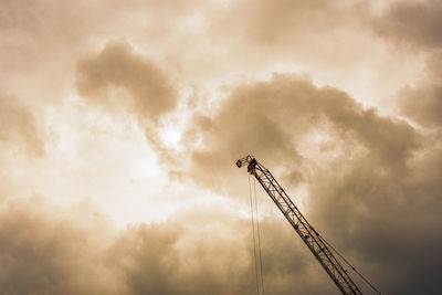 Low angle view of rollercoaster against sky