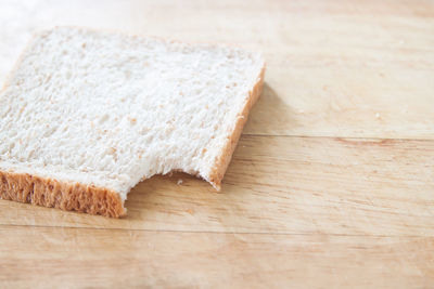 High angle view of bread on cutting board