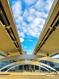 Low angle view of bridge against sky in city