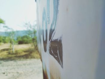 Close-up of glass window against wall