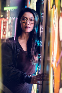 Portrait of young woman standing outdoors in tokyo