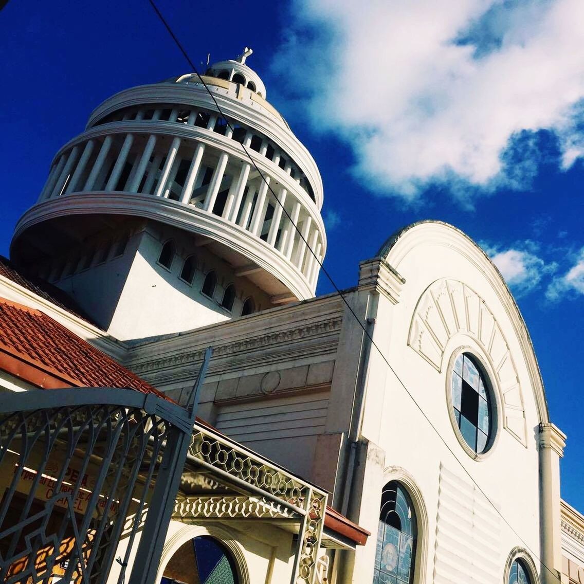 low angle view, architecture, built structure, building exterior, famous place, travel destinations, place of worship, dome, religion, sky, church, international landmark, tourism, travel, blue, capital cities, spirituality, tower, cathedral