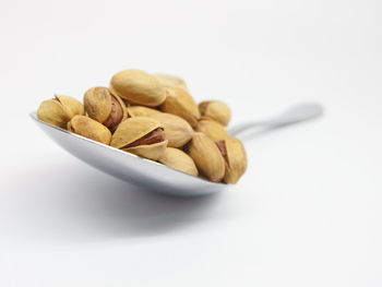 Close-up of bread against white background