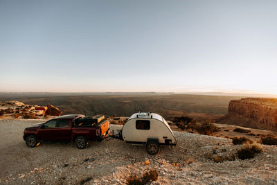 Car parked on land against clear sky