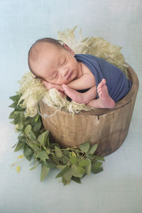 High angle view of baby sleeping in bed