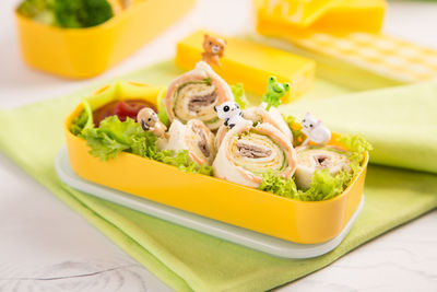 High angle view of food in tiffin box on table