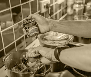 Midsection of man preparing food