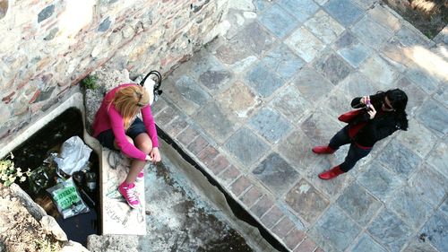 High angle view of woman with umbrella