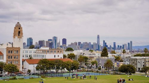 Buildings in city against sky