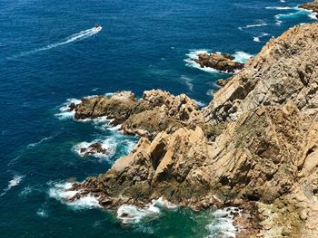 High angle view of rock formation in sea