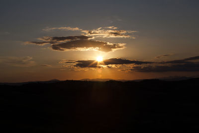 Scenic view of silhouette landscape against sky during sunset