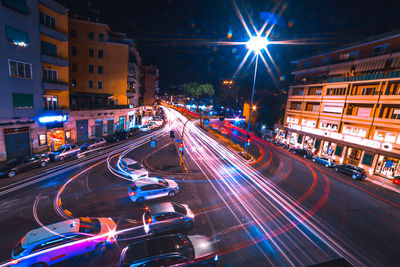 High angle view of light trails on road at night