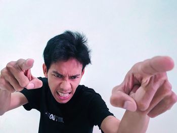 Portrait of man making face