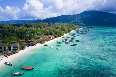Scenic view of sea and mountains against sky